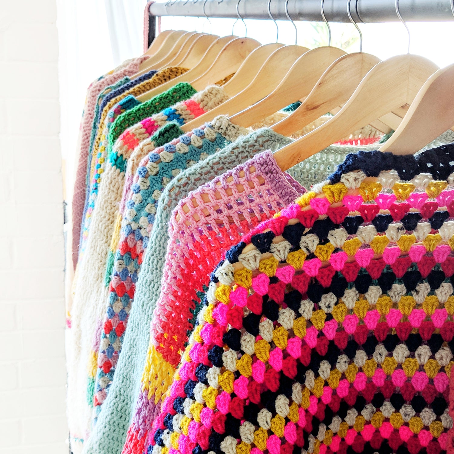 Crochet garments on rail